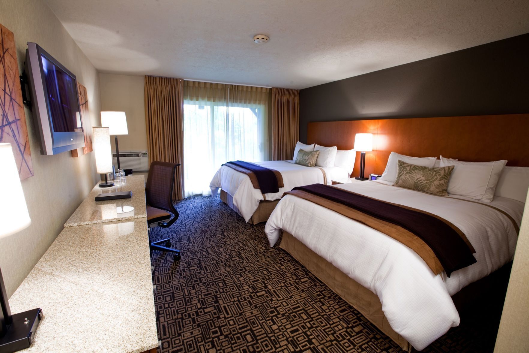 Premium bedding, memory foam beds, in-room safe, desk