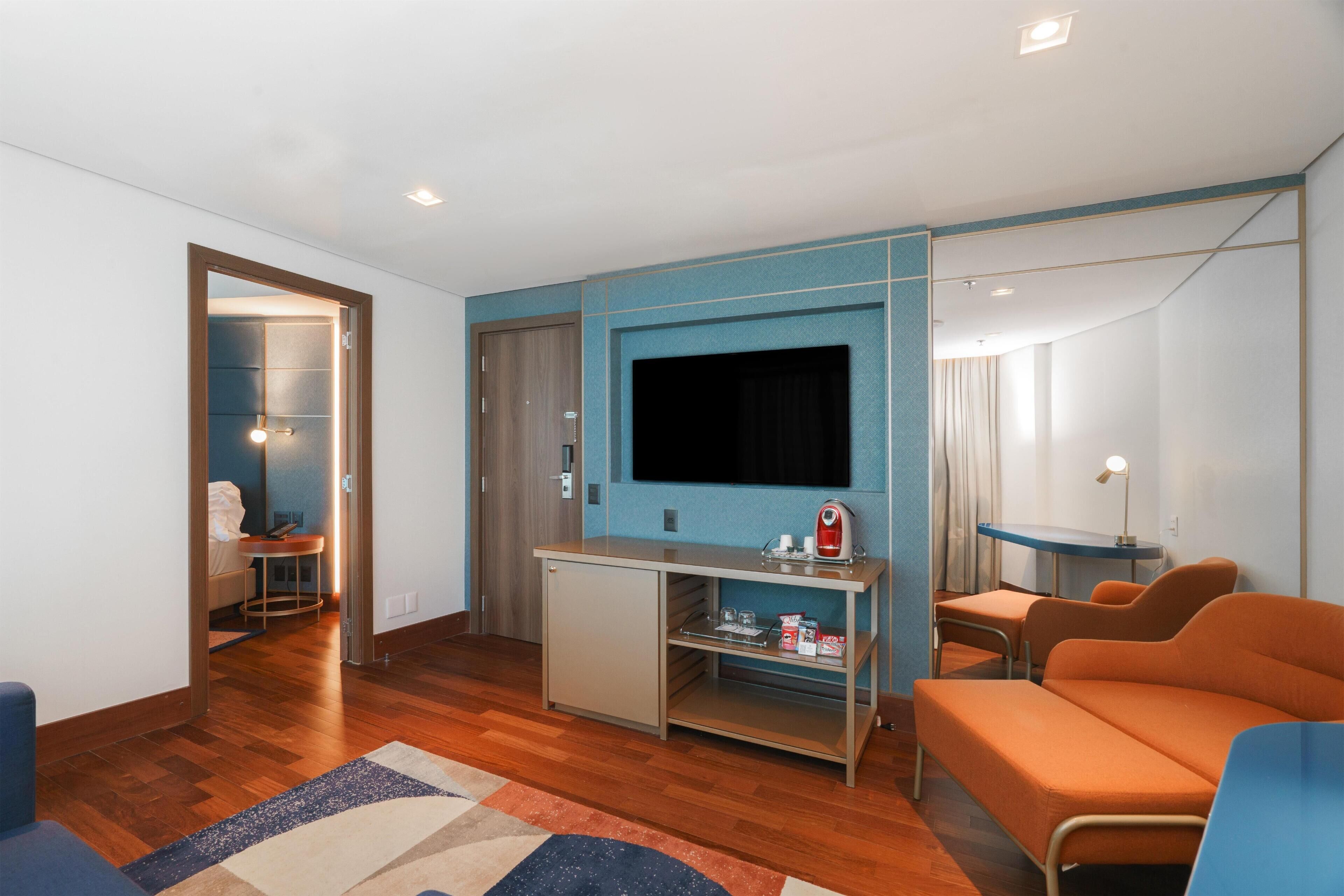 Suite, 1 Bedroom | Living area | 32-inch LCD TV with cable channels, TV, heated floors