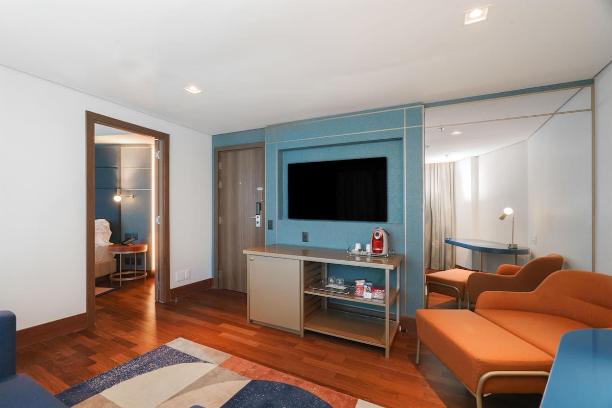 Suite, 1 Bedroom | Living area | 32-inch LCD TV with cable channels, TV, heated floors