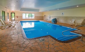 Relax by the pool, surrounded by lounge chairs and a pool lift for accessibility.