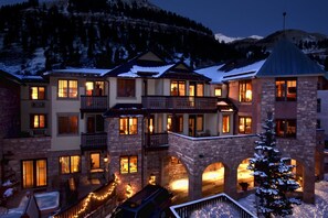 Experience the charm of this traditional hotel, featuring balconies and large windows offering breathtaking views of the surrounding mountains.