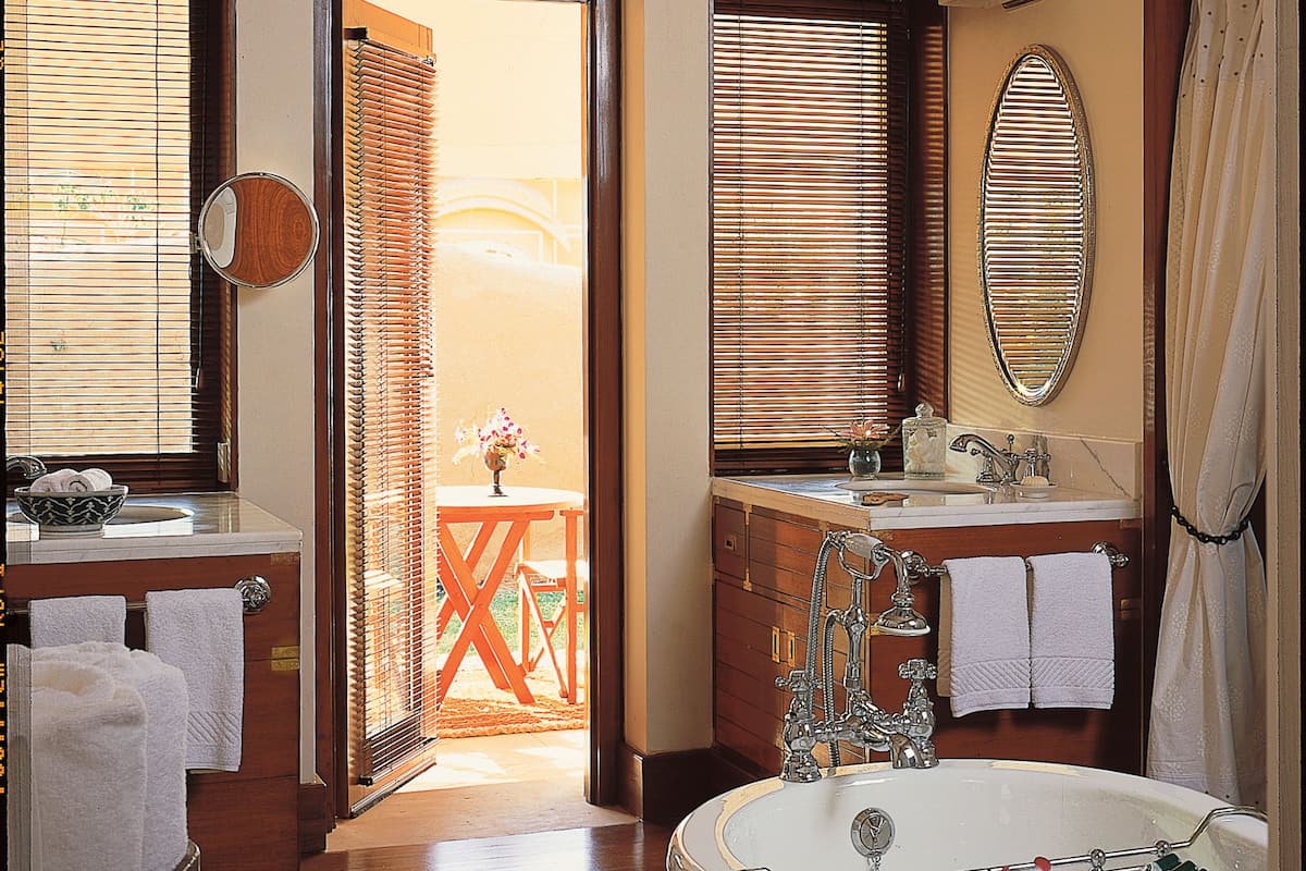 separate bathtub and shower, deep-soaking bathtub, designer toiletries