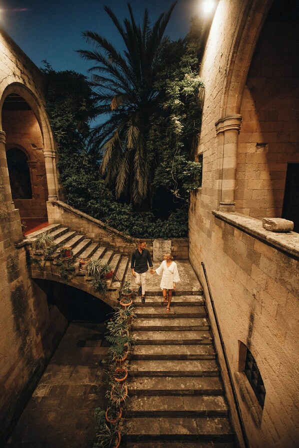 A stone staircase with a palm tree in the background. - Sheraton Rhodes Resort (Rhodes)