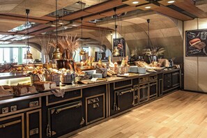 A bakery counter with bread, pastries, and a chalkboard menu. - Sheraton Rhodes Resort (Rhodes)