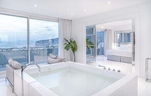 Suite, 1 King Bed (Surya) | Bathroom | Combined shower/bathtub, free toiletries, hair dryer, bidet