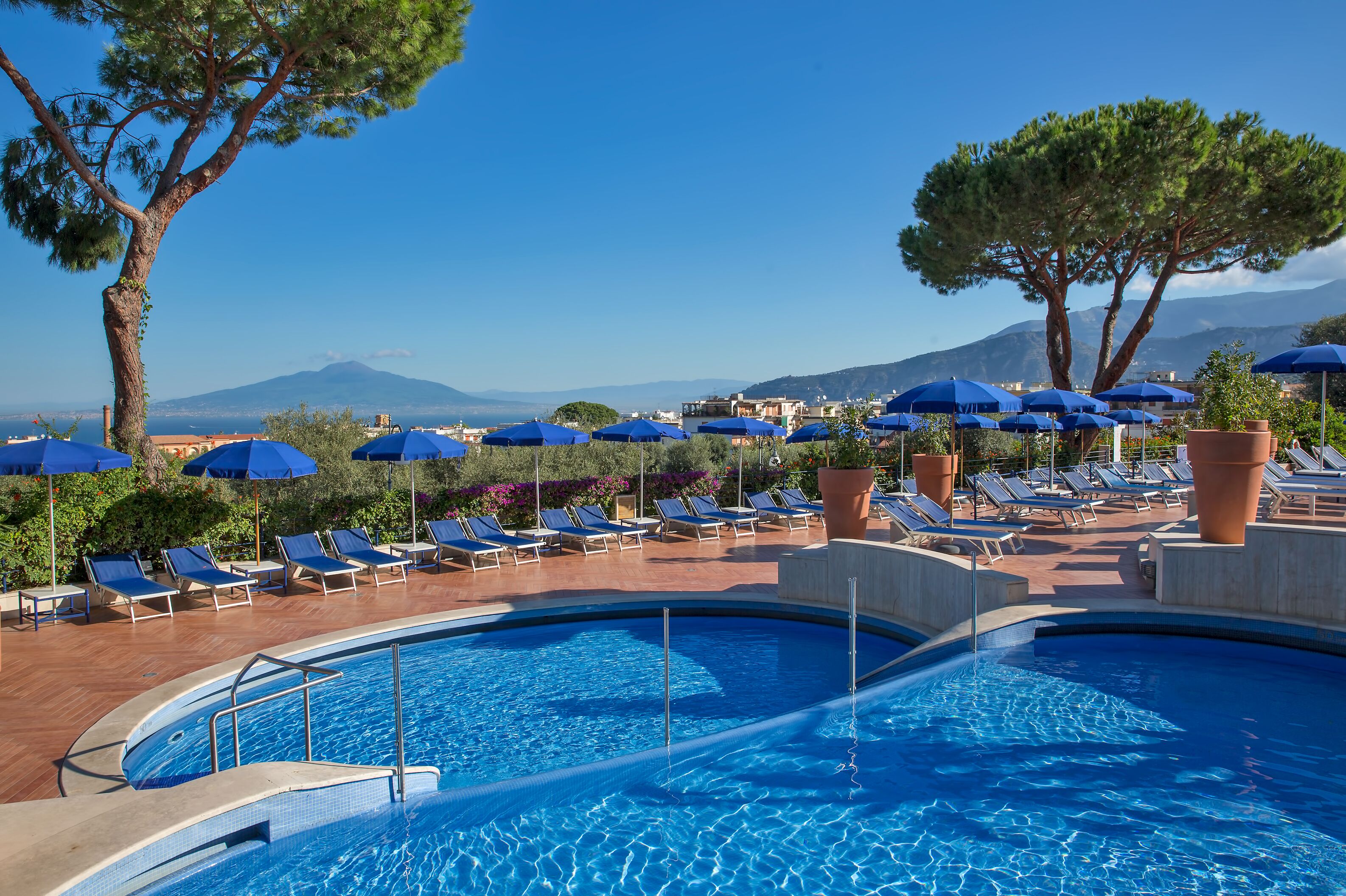 indoor pool, seasonal outdoor pool, pool umbrellas, pool loungers