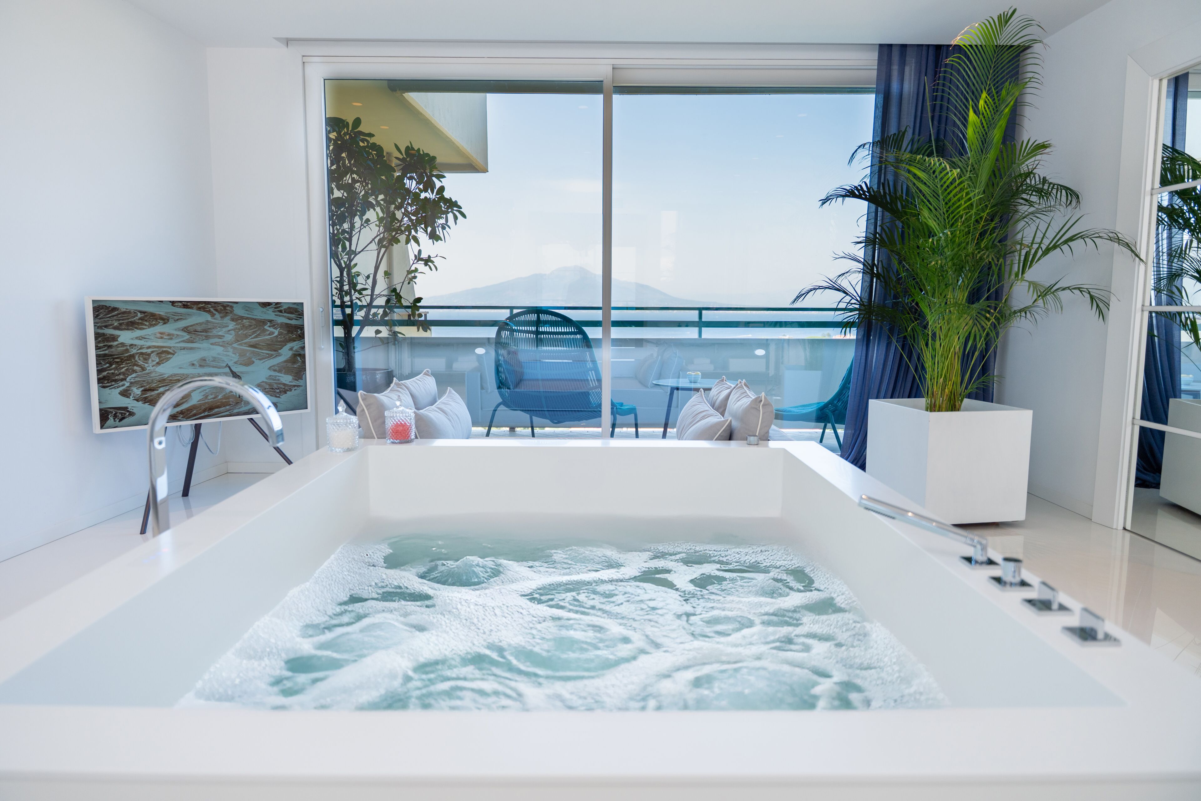 Suite, 1 King Bed (Surya) | Bathroom | Combined shower/bathtub, free toiletries, hair dryer, bidet
