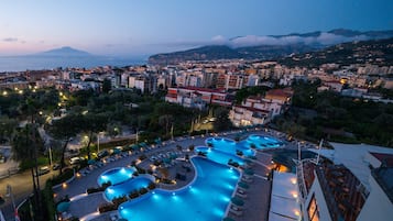 Indoor pool, seasonal outdoor pool, pool umbrellas, pool loungers