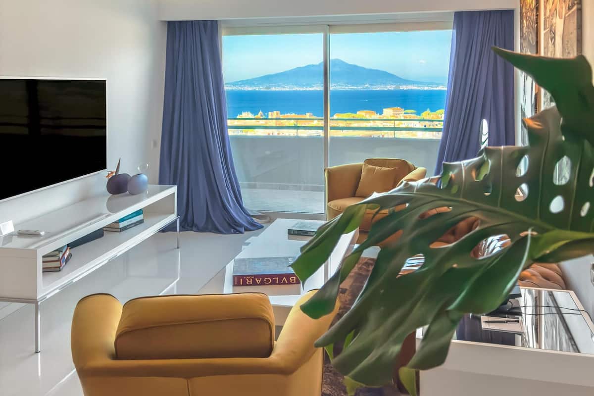 Suite, 1 King Bed (Surya) | Living area | 40-inch LCD TV with satellite channels, TV