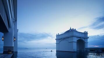 2 outdoor pools, open 7:00 AM to 7:00 PM, pool umbrellas, sun loungers