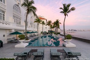 2 outdoor pools, open 7:00 AM to 7:00 PM, pool umbrellas, sun loungers