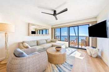 65-inch flat-screen TV with cable channels at Castle Poipu Shores