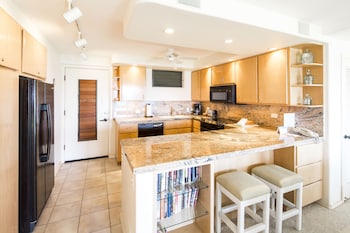 Full-size fridge, microwave, oven, stovetop at Castle Poipu Shores