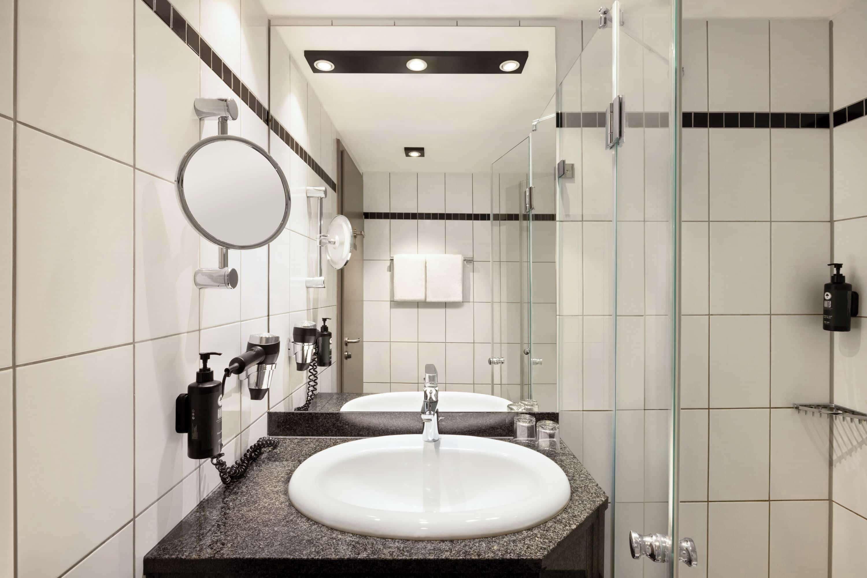 eco-friendly toiletries, hair dryer, towels