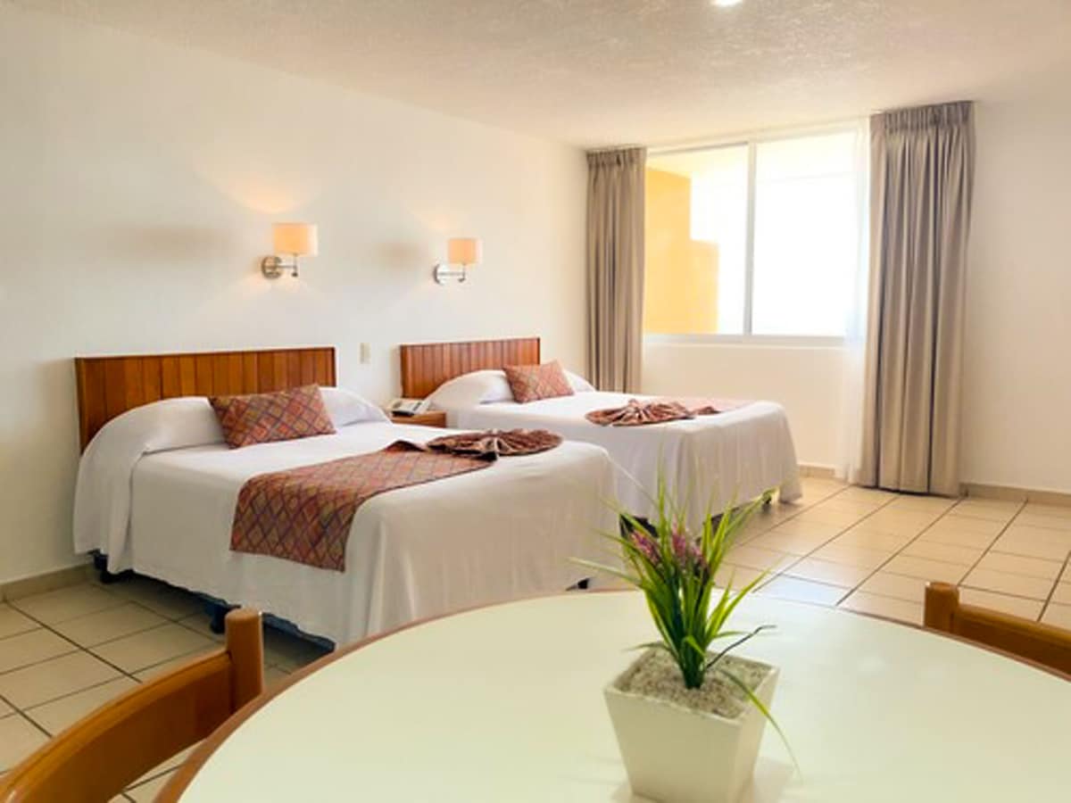 Suite junior, vista al mar | Escritorio, cortinas blackout, wifi gratis y ropa de cama