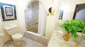 Deep-soaking bathtub, rainfall showerhead, free toiletries, hair dryer