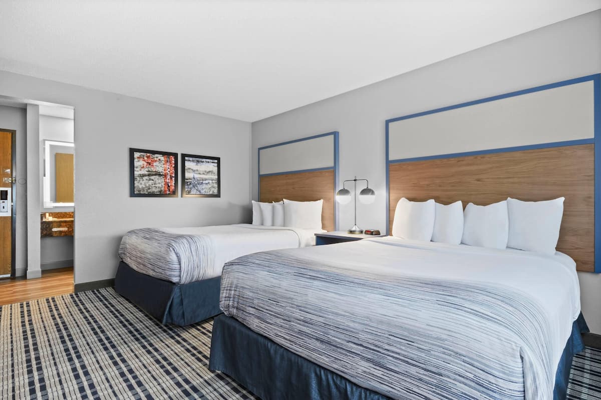 Room, 2 Queen Beds, Non Smoking | In-room safe, desk, iron/ironing board, free cribs/infant beds