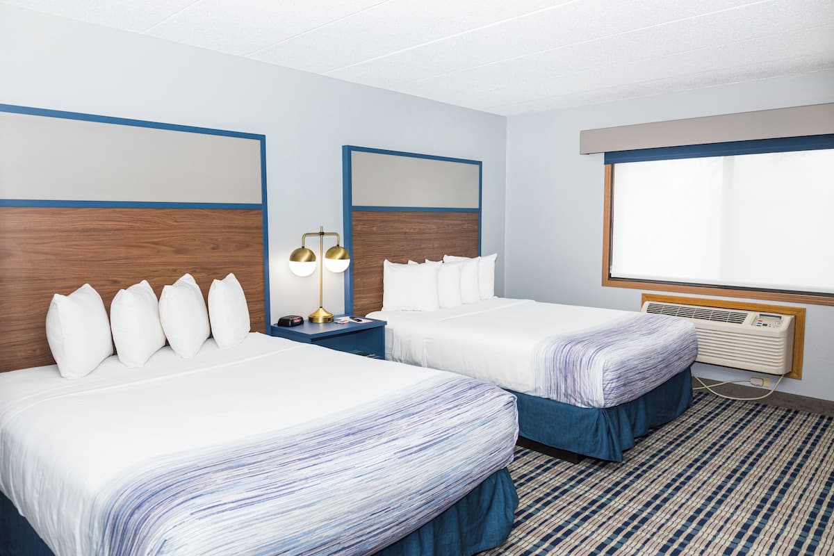 room, 2 queen beds, non smoking | in-room safe, desk, iron/ironing board, free cots/infant beds