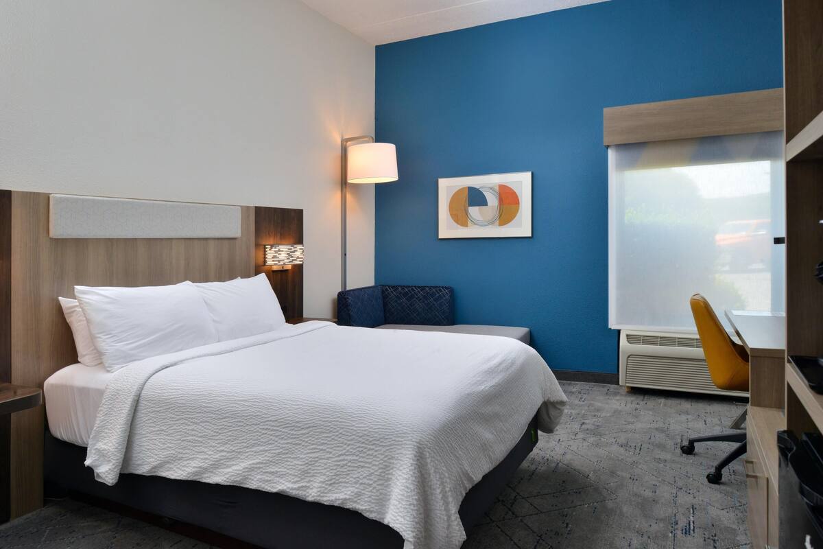Premium bedding, desk, laptop workspace, iron/ironing board