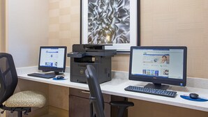 A workspace with two desktop computers, a printer, and office chairs. - Holiday Inn Express Berea by IHG (Berea)