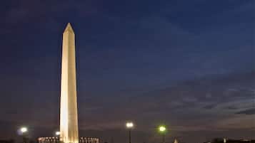 A tall, illuminated monument at night.