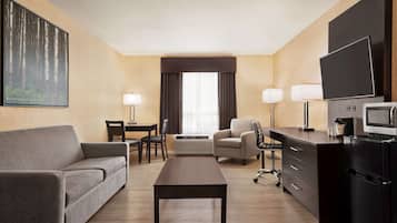 Premium bedding, desk, laptop workspace, blackout drapes