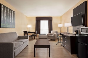Premium bedding, desk, laptop workspace, blackout drapes