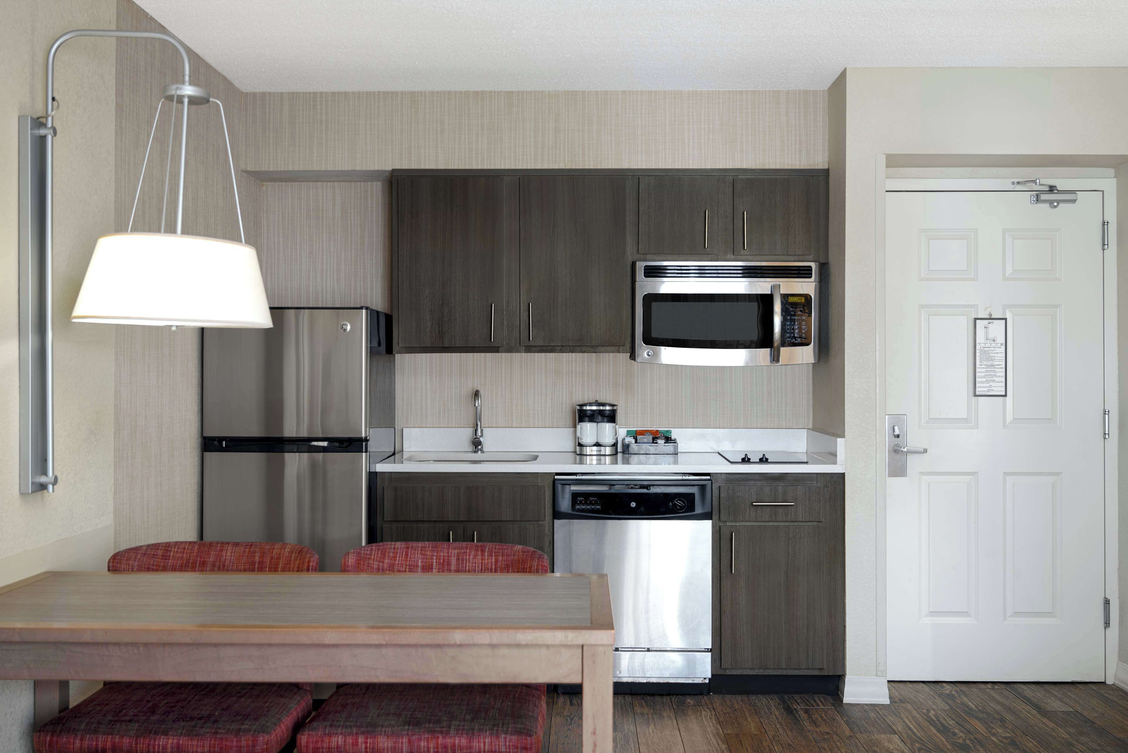 full-sized fridge, microwave, stovetop, dishwasher