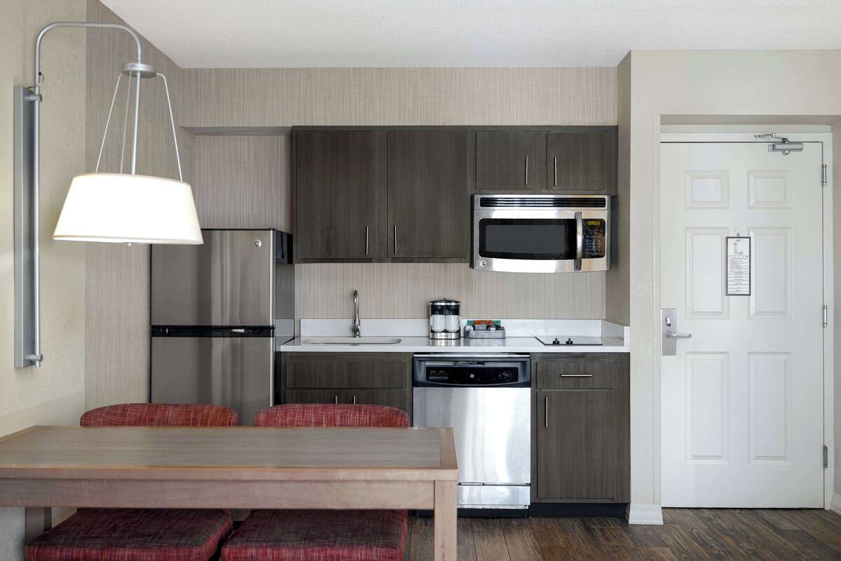 full-sized fridge, microwave, stovetop, dishwasher