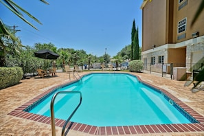 Outdoor pool, open 9:00 AM to 10:00 PM, pool umbrellas, pool loungers