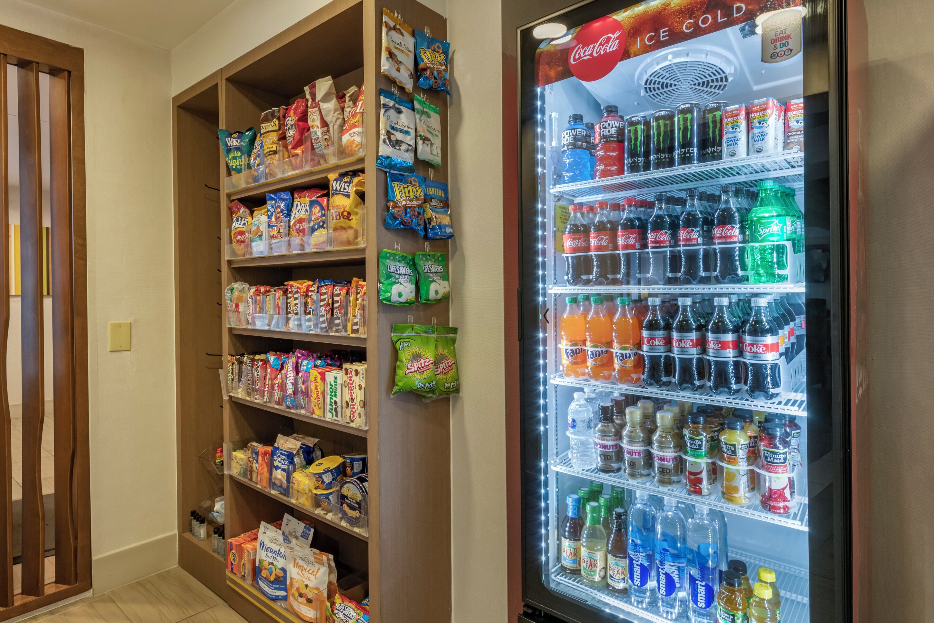 A vending machine stocked with various beverages and snacks.