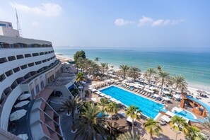 Outdoor pool, open 7:00 AM to 8:00 PM, pool umbrellas, pool loungers