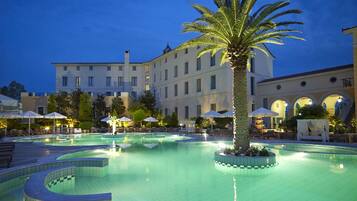 Indoor pool, outdoor pool, pool umbrellas, pool loungers