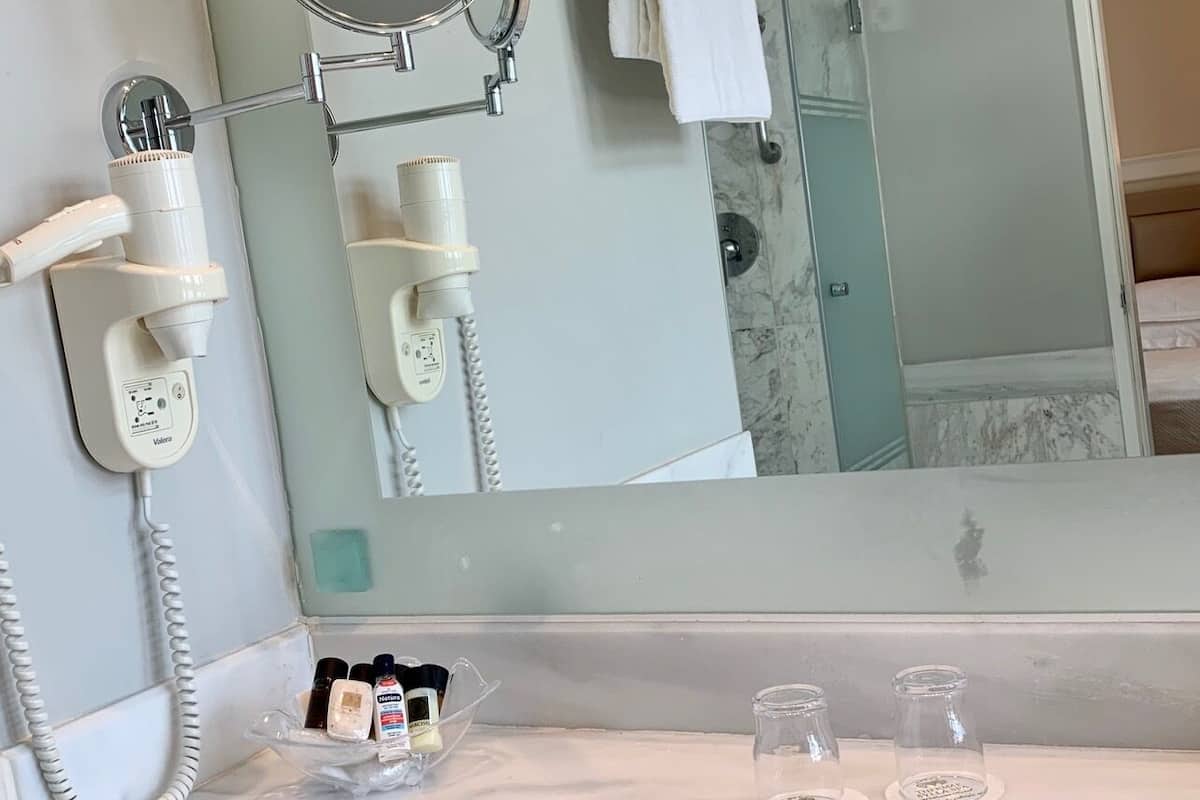 hair dryer, bathrobes, slippers, towels