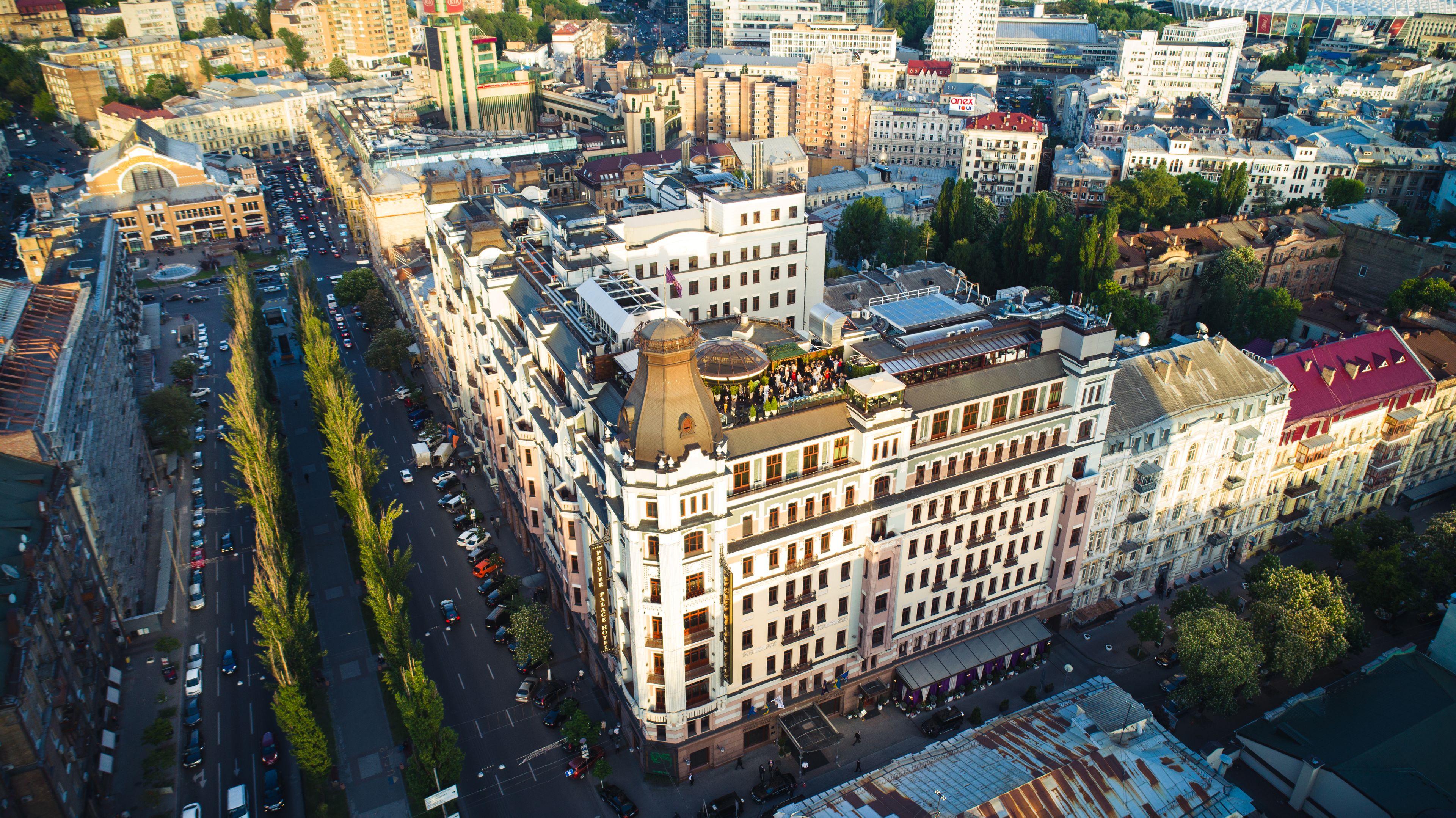 An aerial view of a historic building with multiple floors, large windows, and a prominent dome structure.