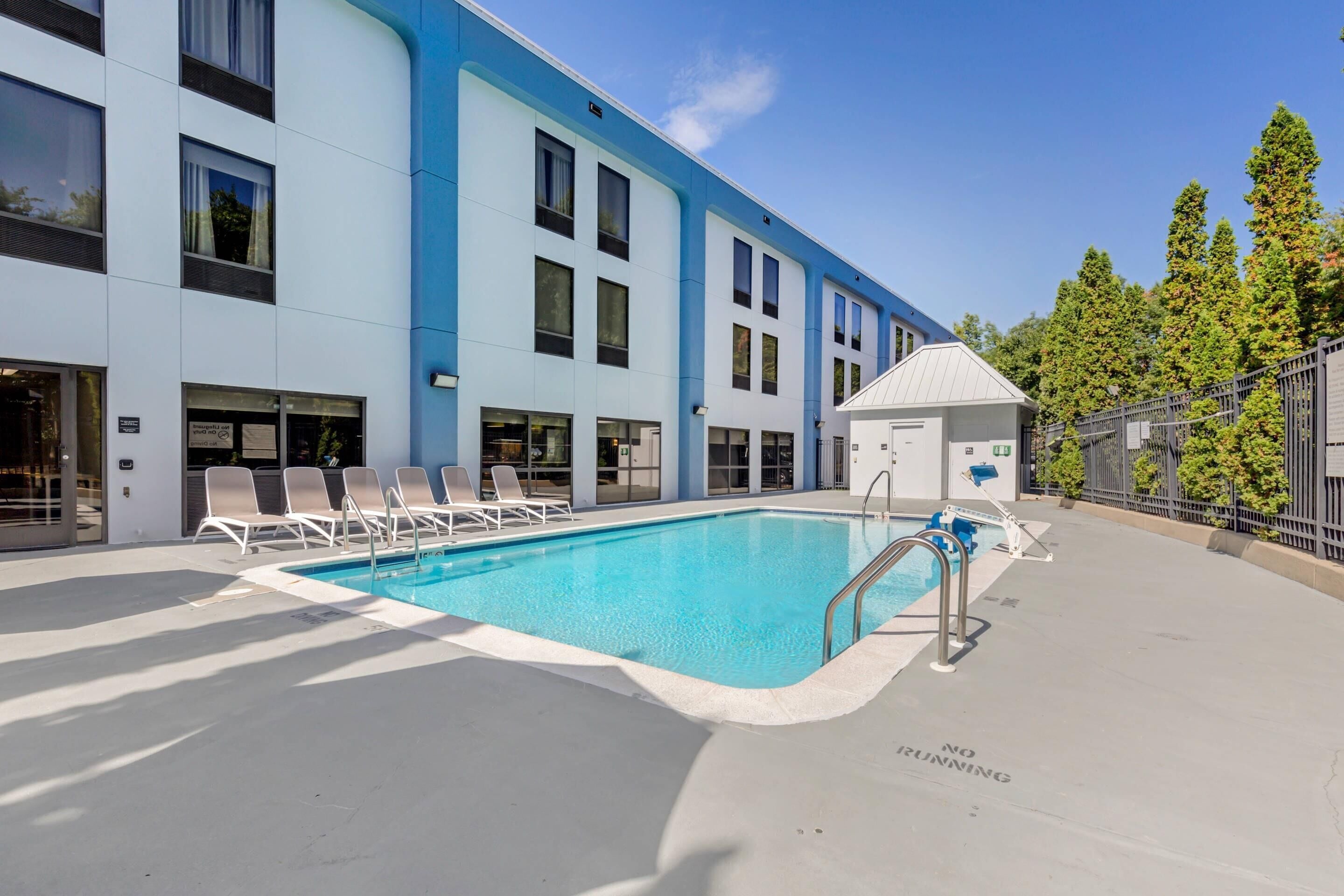 Seasonal outdoor pool, open 8 AM to 8 PM, pool umbrellas, pool loungers