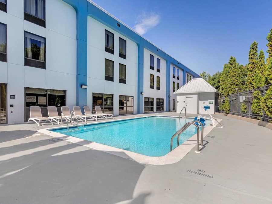 Seasonal outdoor pool, open 8 AM to 8 PM, pool umbrellas, pool loungers