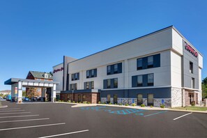 A modern hotel with a flat roof, multiple windows, and a sign reading "Huntington Inn". - Hampton Inn Cincinnati Airport - North (Hebron)