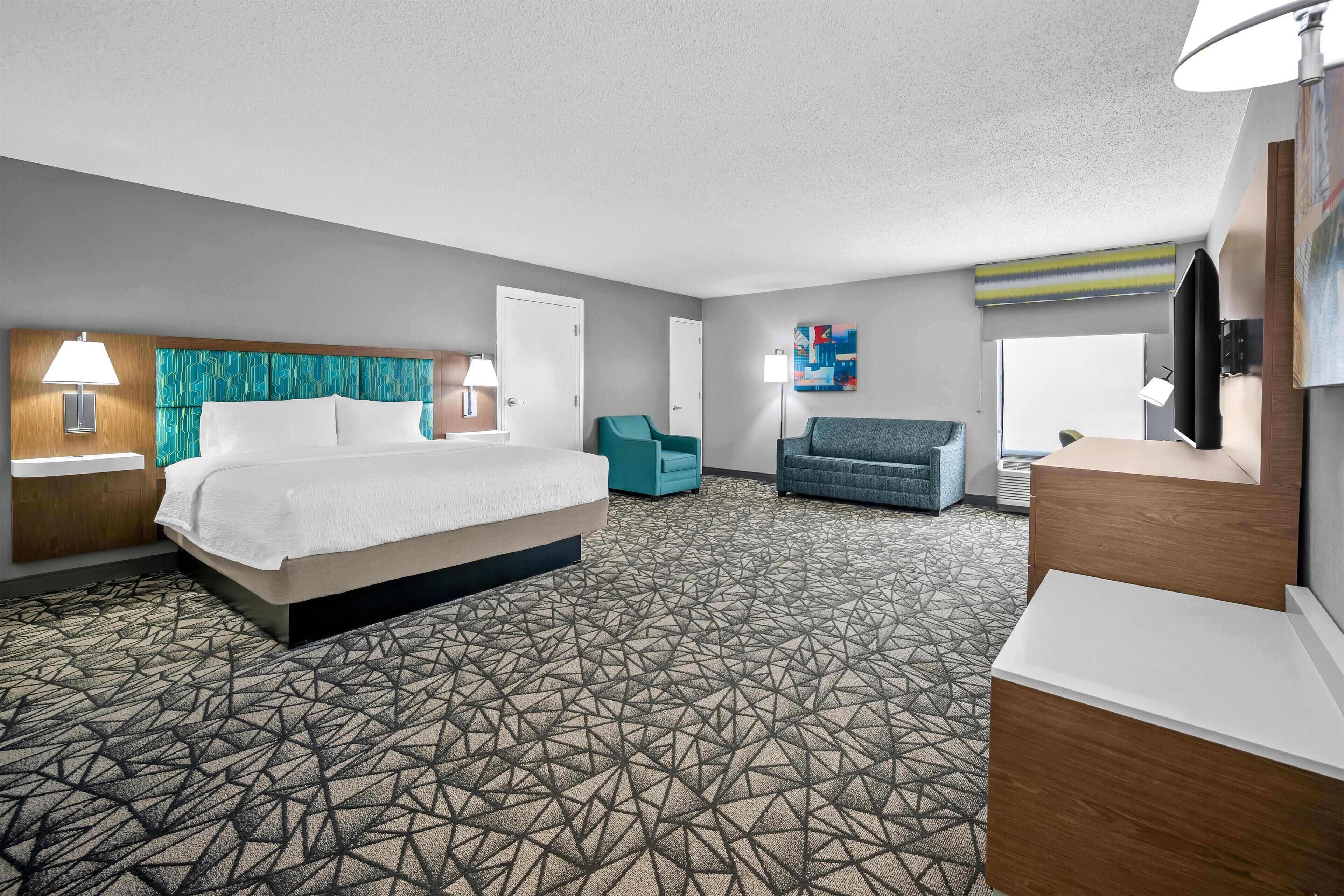 Suíte, 1 cama King, para não fumantes | Área de estar | TV LCD 32 polegadas com canais de TV premium, TV, filmes pagos