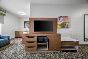 Suite, 1 cama King size, para no fumadores | Área de sala de estar | Televisión LCD de 32 pulgadas con canales premium y televisión 