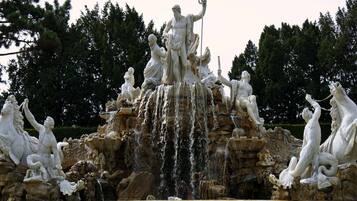A large outdoor fountain with multiple statues and water features.