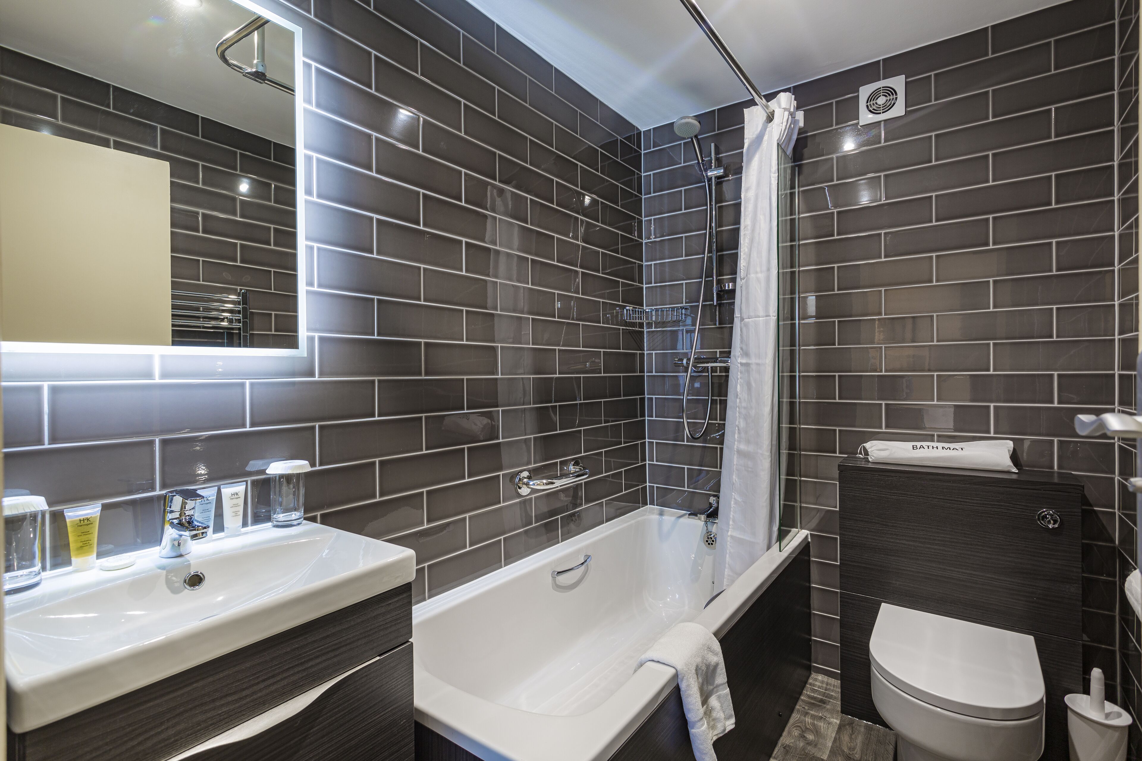superior twin room | bathroom | hair dryer, towels