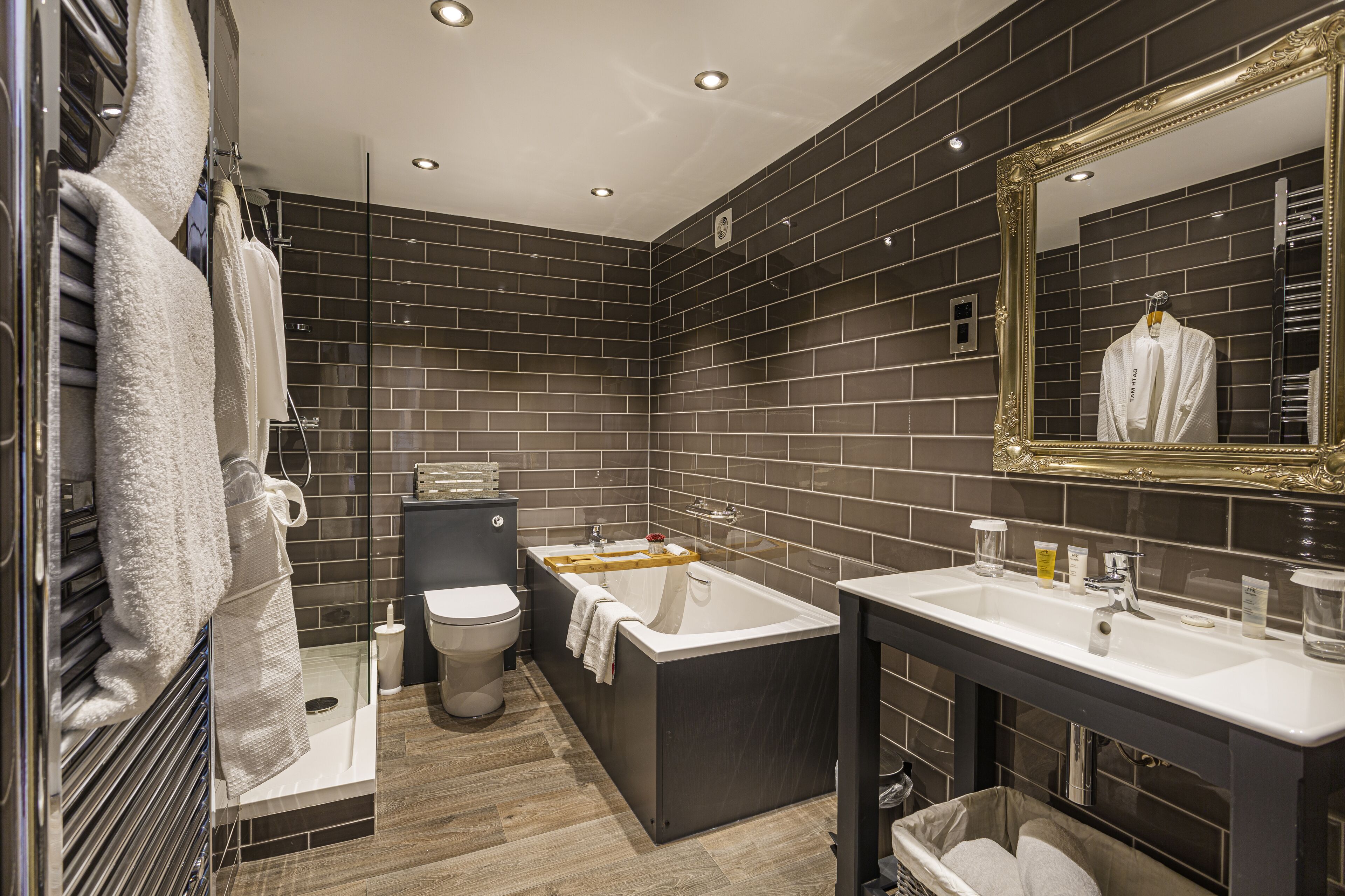 deluxe suite | bathroom | hair dryer, towels