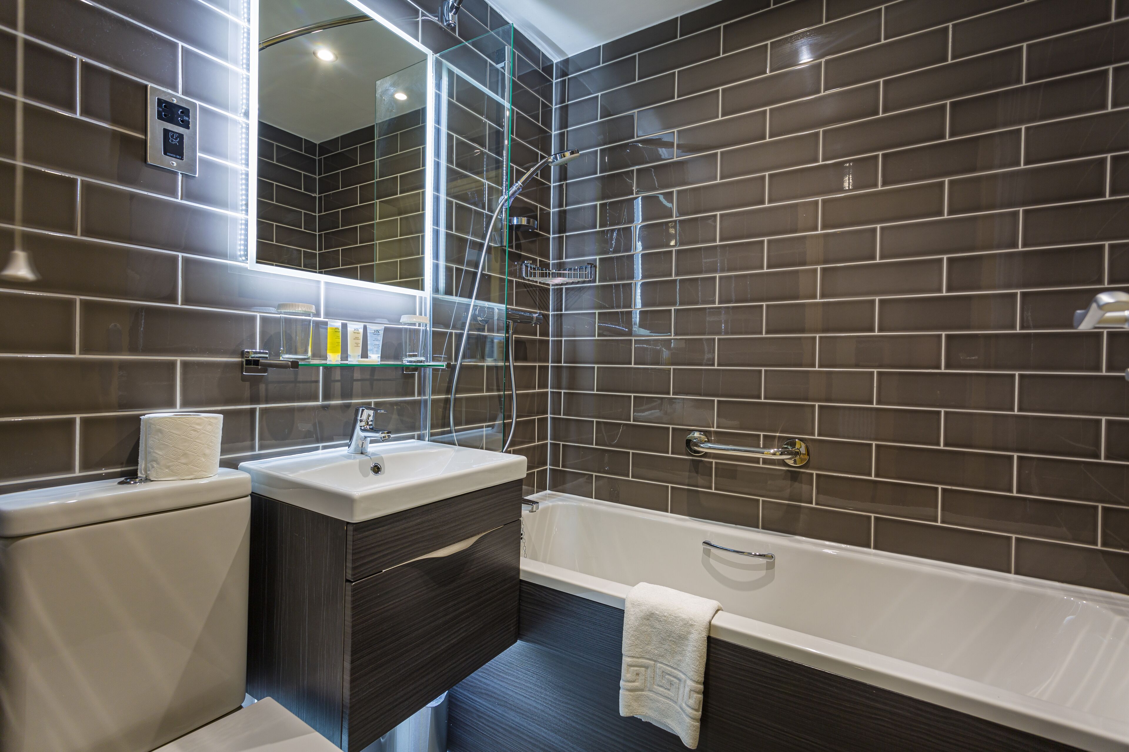 deluxe four poster room | bathroom | hair dryer, towels