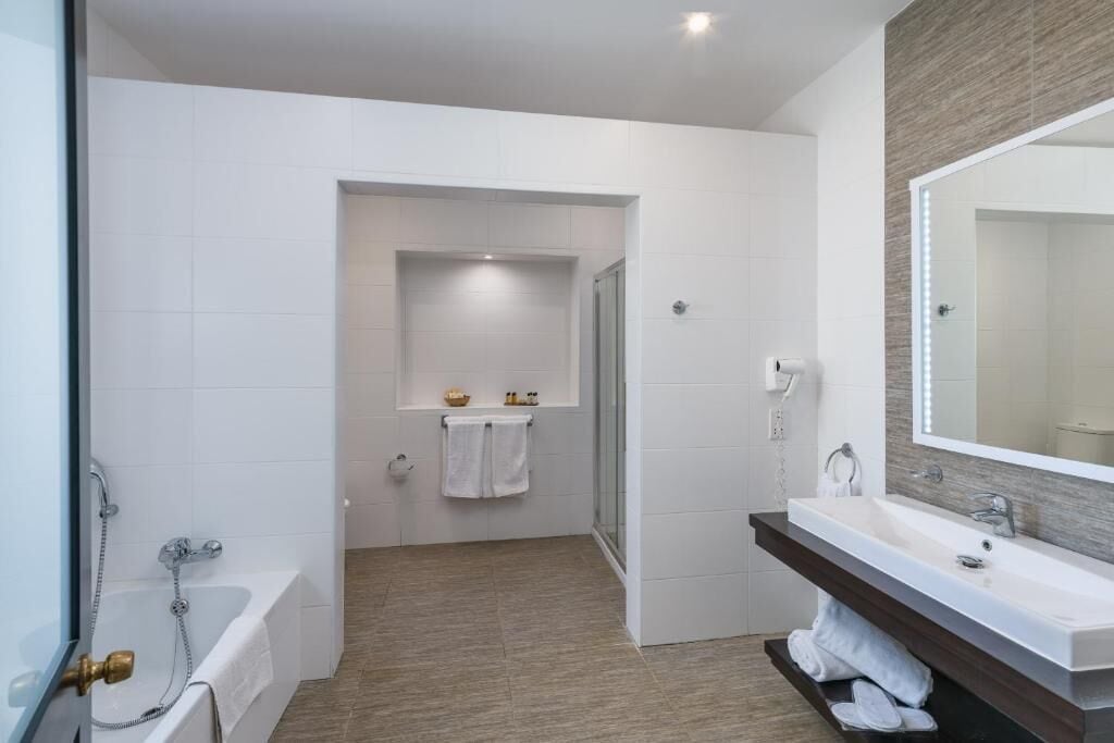 studio suite | bathroom | designer toiletries, hair dryer, bathrobes, slippers