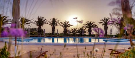 Indoor pool, pool umbrellas, pool loungers