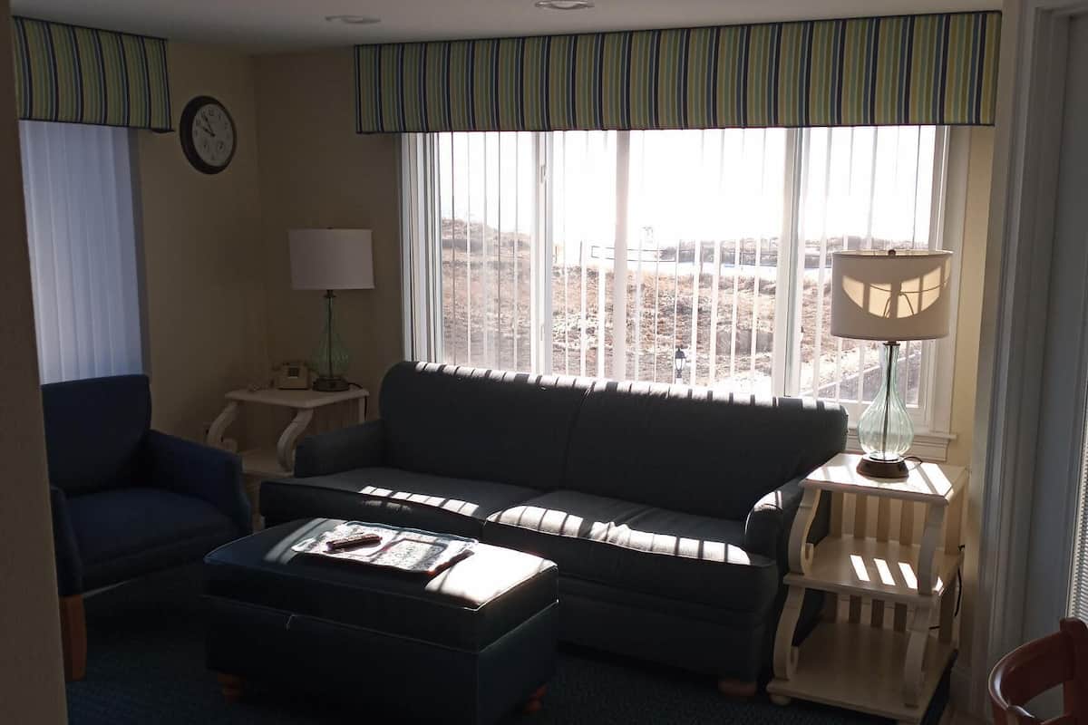 Deluxe Suite, 2 Bedrooms, Ocean View | Living area | Flat-screen TV, fireplace, DVD player