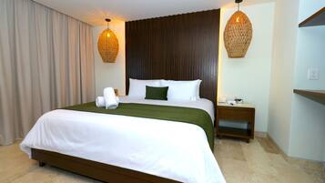 Suíte grand, vista para o mar | Roupa de cama