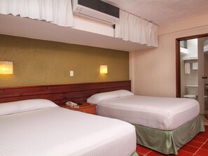 Suite, 2 Double Beds | In-room safe, desk, iron/ironing board, free cribs/infant beds - Hotel Casa Colonial Cozumel (Cozumel)