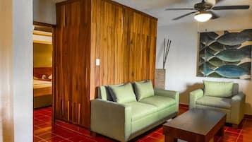 Suite, 2 Double Beds | Living area | Plasma TV